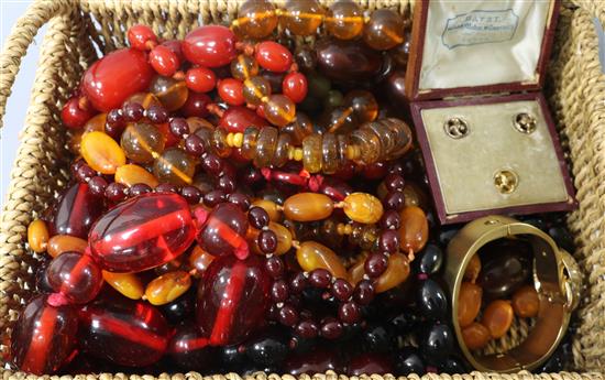 A small group of assorted bead necklaces including amber and simulated amber, a cased set of three dress studs and a gilt bangle.